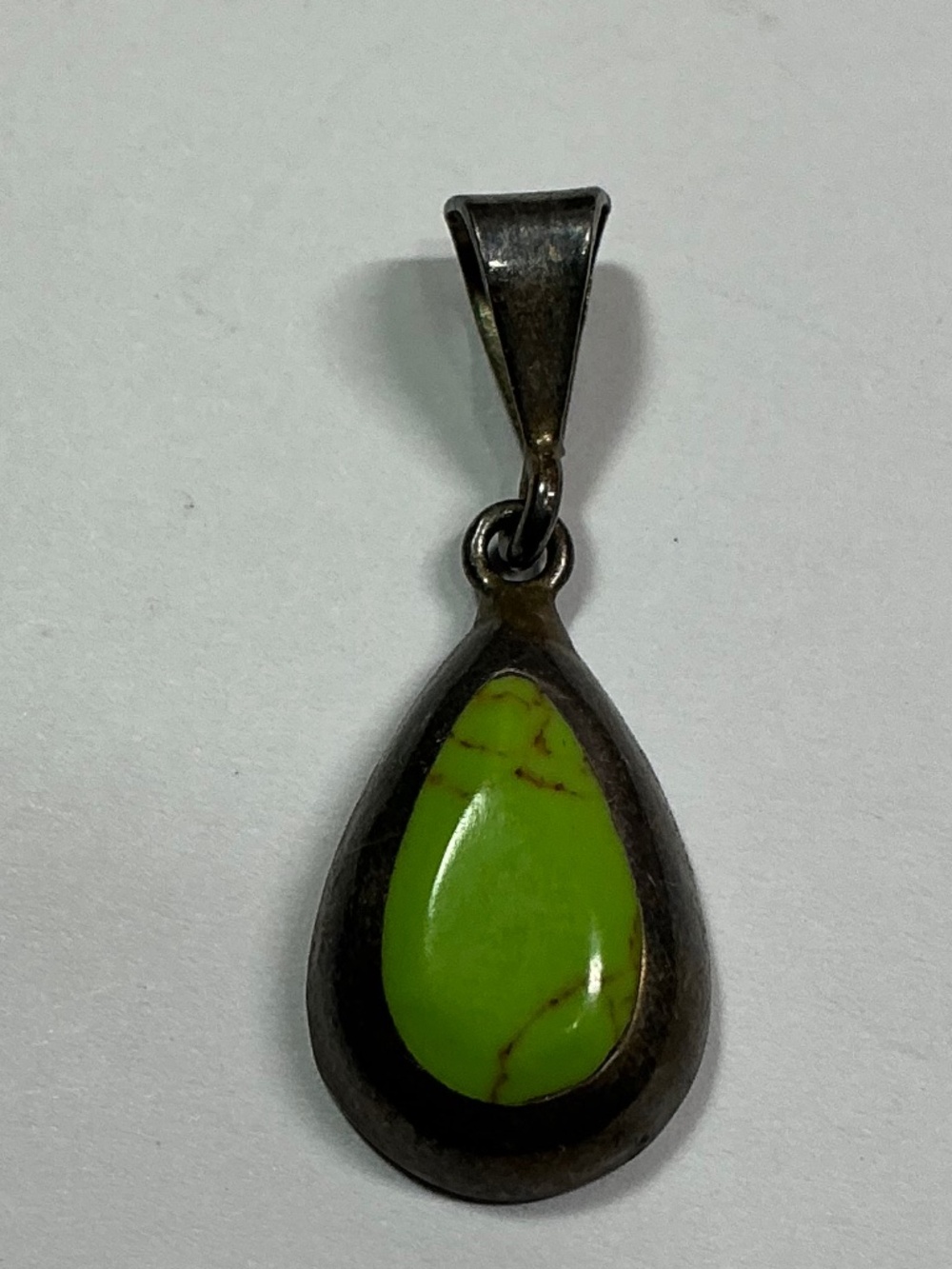 Vintage Sterling Silver Teardrop Shaped Pendant with a Green Stone. 1.25” long